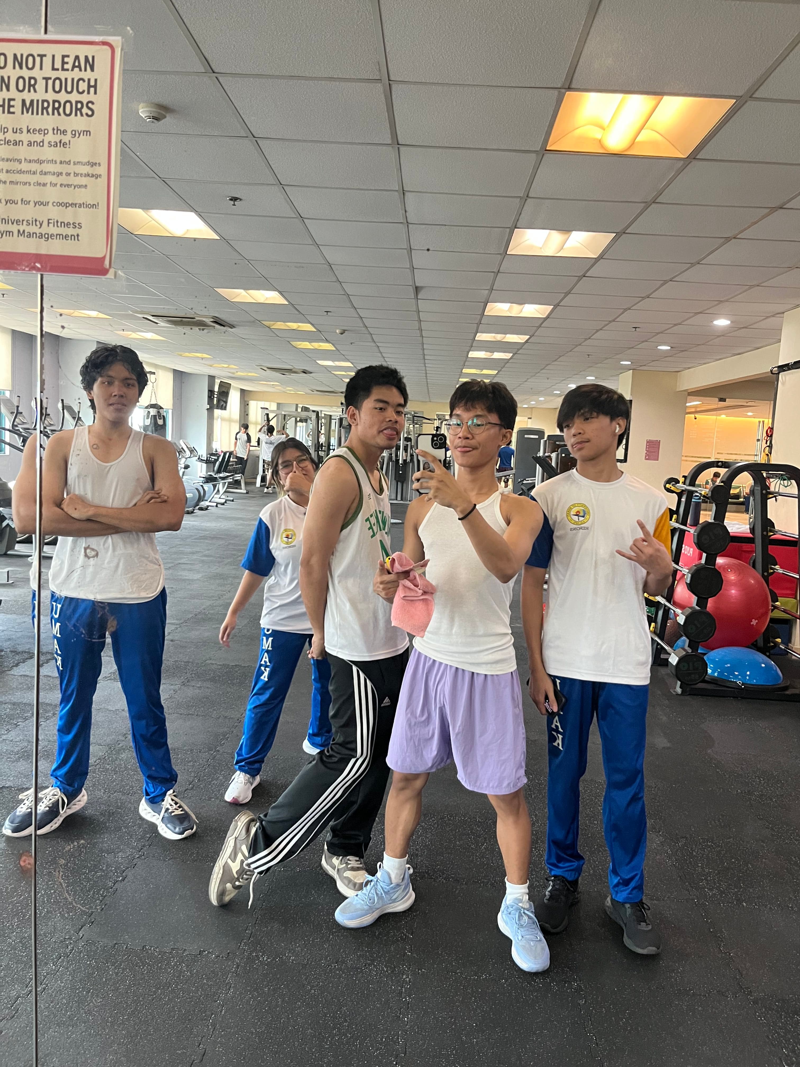 Gym mirror photo with friends
